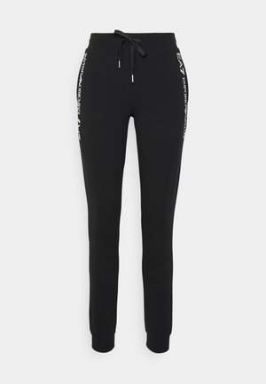 Pantalones jogger ajustados negros con puños elásticos y cintura con cordón, con logos blancos EA7 Emporio Armani en las costuras laterales.