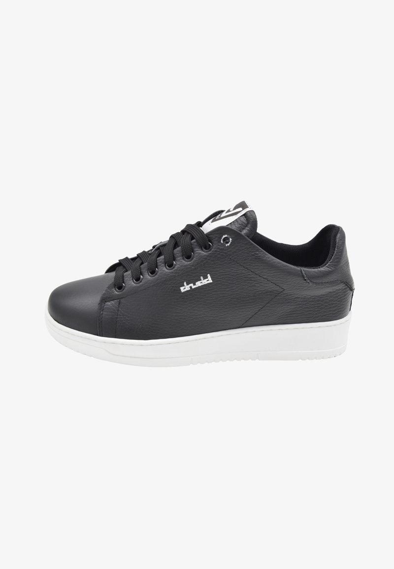 Black leather sneaker with a smooth texture, white rubber sole, six eyelets, and a logo detail on the side. Classic low-top design.