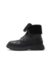 Black lace-up boots with a padded, faux fur collar, rubber sole, and textured leather panels. Features a rounded toe and contrasting stitching.
