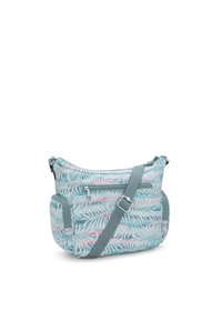 Skuldertaske med et tropisk bladmønster i mintgrøn, pink og hvid. Fremstillet af blødt, holdbart stof, med en tværgående rem og lynlåslommer.