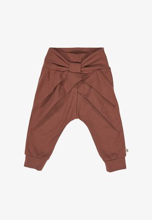 Brązowe bawełniane spodnie z supełkiem w talii, zwężanymi nogawkami i luźnym krojem. Miękka tekstura o gładkim wykończeniu.