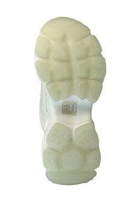Semelle d'une sneaker avec un extérieur en caoutchouc translucide texturé. Présente un motif de crampons arrondis pour la traction et la stabilité.