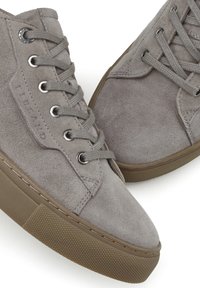 Gray suede high-top sneakers with round toe, flat rubber sole, and six eyelet lacing system; features textured tread and embossed logo.