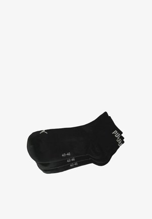 Schwarze Sportsocken, Baumwollmischung, gerippter Bund, Größe 43-46 an den Seiten gedruckt, verstärkte Ferse, minimales Logo-Highlight.