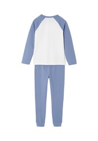 Long-sleeve white top with blue raglan sleeves paired with blue jogger-style pants, both laid flat, back view.