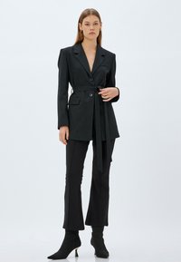 Koton FLARED - Pantaloni - black