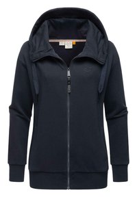 Hoodie bleu marine zippé avec un col haut, une capuche réglable avec cordon, des manches longues et des poches latérales. Tissu doux avec des poignets côtelés.