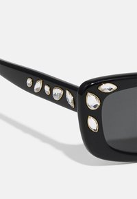 Swarovski Päikeseprillid - black