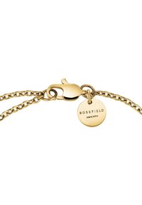 Gold chain bracelet with a lobster clasp and a round charm engraved with "ROSEFIELD" attached to it. Features a smooth, shiny surface.
