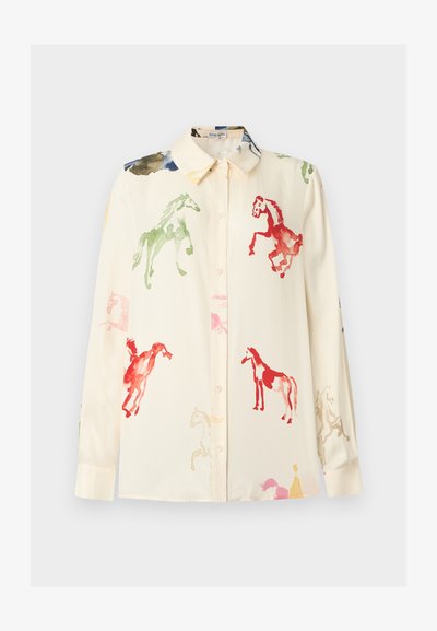 Kerma pitkähihaiset napilliset paita, jossa monivärisiä vesivärillä maalattuja hevosten kuvia punaisena, vihreänä, pinkkinä ja sinisenä.