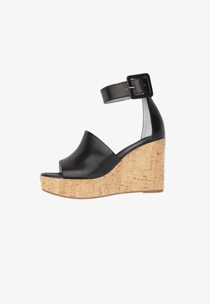 Sandale compensée en cuir noir avec bout ouvert, bride cheville, boucle carrée et semelle plateforme en liège.
