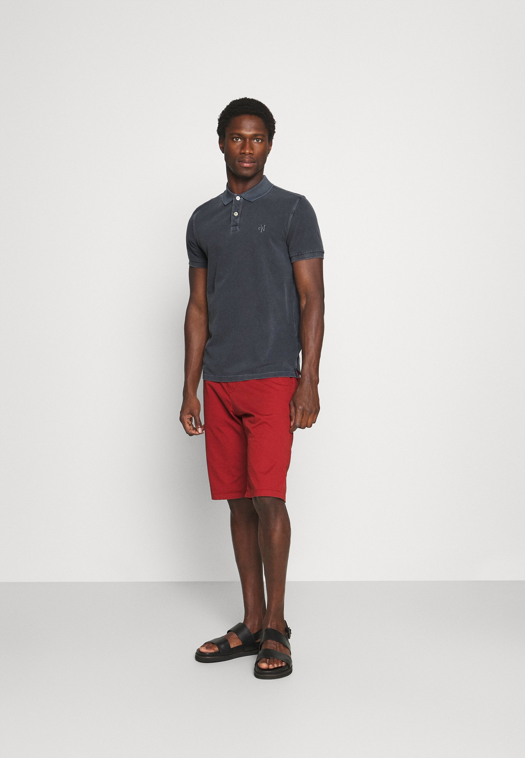 black and red polo shorts