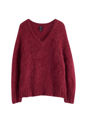 V-hals, løstsiddende sweater i en dyb burgunderfarve. Lavet af struktureret, fuzzy stof med lange ærmer og en afslappet kant.