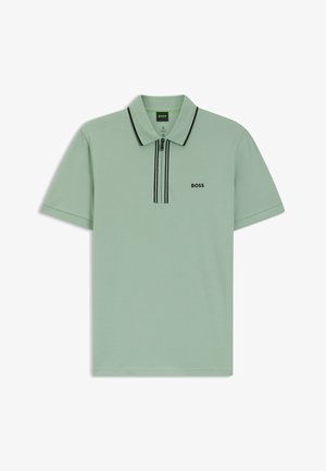 Polohemd in Minzgrün mit kurzen Ärmeln, einem Reißverschlusskragen und schwarzen Akzentstreifen. Mit einem kleinen schwarzen Logo auf der Brust.