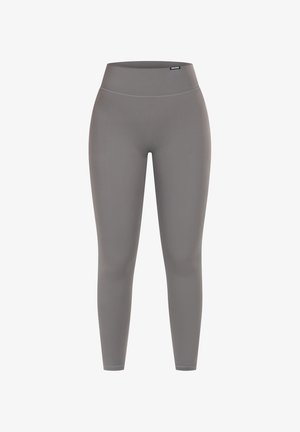 Harmaat legginsit, jotka on valmistettu joustavasta kankaasta. Korkea vyötärö, slim fit -malli, sileä pinta, ei näkyviä saumoja tai kuvioita, sopii aktiiviseen käyttöön.