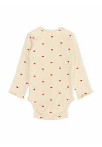 Body pentru bebeluși cu mânecă lungă, dintr-un material rib, de culoare crem, cu modele mici de inimioare roșii. Dispune de manșete volărate și închideri cu capse în partea de jos.