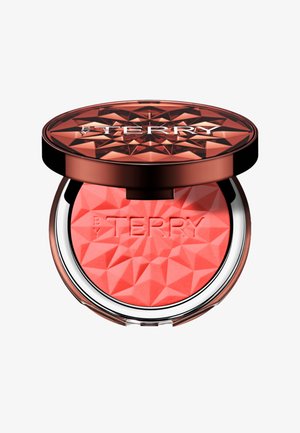 Runder Rouge-Compact mit einem kunstvollen, reflektierenden Golddeckel und einem strukturierten orange-roten Puderinnenraum, geprägt mit "BY TERRY."