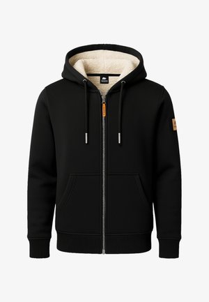 Schwarze Zip-Hoodie mit cremefarbener Fleece-Fütterung, frontalen Taschen, Kordeln, gerippten Bündchen und einem braunen Logo-Patch auf dem linken Ärmeln.