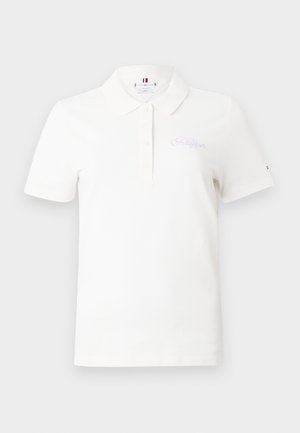 White short-sleeve polo shirt made of cotton. Features a classic collar, button placket, and embroidered logo in light purple on the chest.