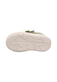 Schuhsohle mit einem strukturierten weißen Gummidesign, das Zickzack-Profilmuster und kreisförmige Griffe zeigt, ideal für Traktion und Stabilität.