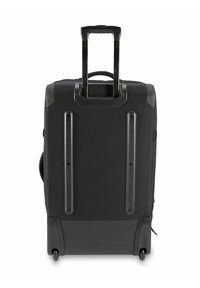 Valigia nera da viaggio realizzata in tessuto resistente, dotata di manico retrattile, ruote fluide e un design minimalista con accenti verticali.