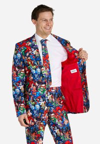 Multicolored superhero suit featuring a bold character print, with a red inner lining and matching tie. Tailored fit with detailed graphics.