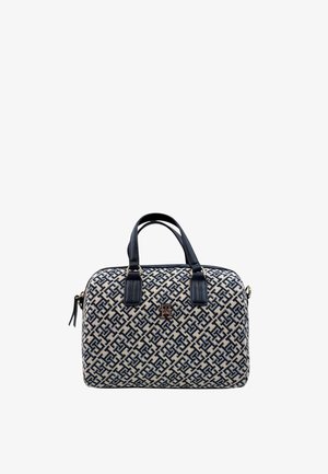 Borsa a mano beige e navy con motivo, manici superiori doppi, placca con logo dorato e texture liscia. Presenta una chiusura con zip e una forma strutturata.