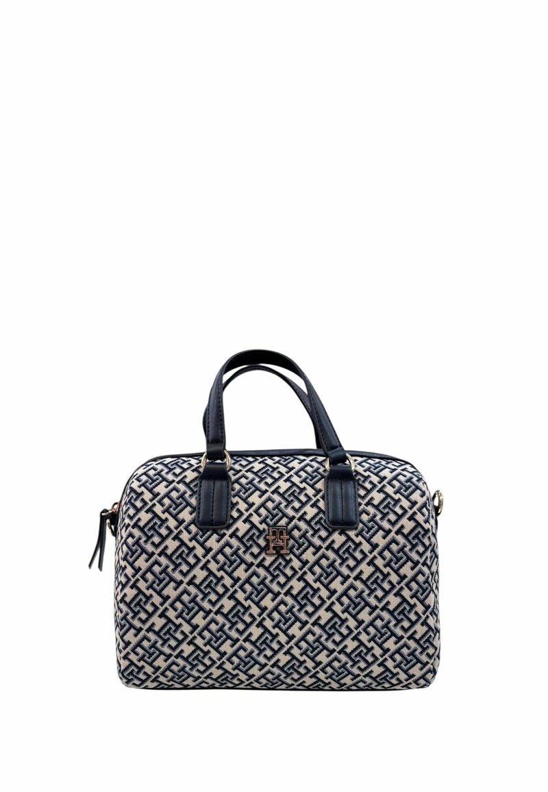 Borsa a mano beige e navy con motivo, manici superiori doppi, placca con logo dorato e texture liscia. Presenta una chiusura con zip e una forma strutturata.