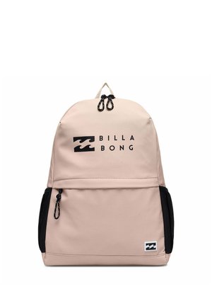 Sac à dos Billabong beige avec tirettes de fermeture éclair noires, poches latérales et logo frontal avec texte noir et motif vague.