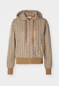 Beige hooded zip-up sweatshirt met een geometrisch patroon, voorzien van ribgebreide manchetten, trekkoorden en een logo-accent op de borst.
