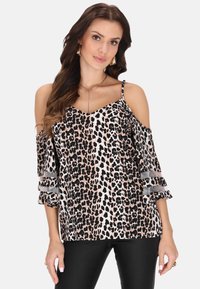 Kalt-Bereich Oberteil mit Leopardenmuster in einer Mischung aus Beige, Schwarz und Weiß. Verfügt über Rüschensäume mit durchscheinenden Akzenten.
