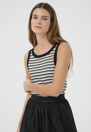 Striped tank top featuring black and white horizontal stripes, textured fabric, a round neckline, and black armholes, paired with a black skirt.