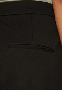 Vero Moda Petite VMEMMA SLIM - Trousers - black