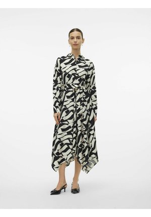 Black and white abstract patterned shirt dress with a belted waist, long sleeves, and an asymmetrical hemline. Material appears smooth.