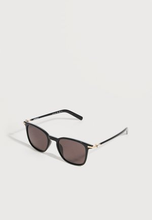 Black-framed rectangular sunglasses with dark lenses and slim temples featuring gold accents, displayed on a white surface.