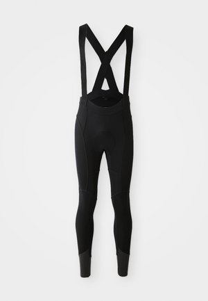 Schwarze Radsport-Bibshorts mit verstellbaren X-förmigen Trägern, strukturierten Einsätzen und eng anliegenden Beinen, die zum Knöchel hin zulaufen.