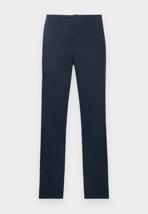 Marineblå slim-fit bukser med bæltestropper, knaplukning og flad front vist på en ensartet lys baggrund.