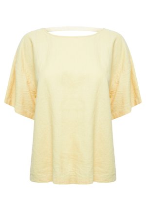 Top de lino amarillo con un amplio escote redondo, mangas cortas estilo kimono y corte recto; presenta un pequeño detalle de abertura en la parte posterior.