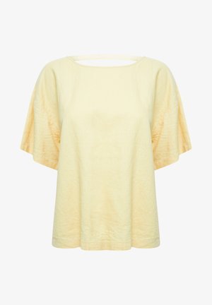 Żółta lniana bluzka z szeroką okrągłą dekoltem, krótkimi rękawami kimono oraz prostym krojem; ma małe wycięcie z tyłu.