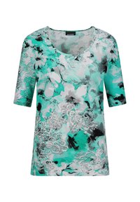 Korte mouwtop in teal met een witte bloemenprint en zwarte accenten. Heeft een brede ronde halslijn en een ontspannen pasvorm.
