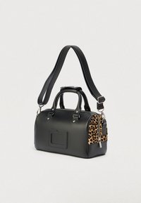 Black synthetic handbag with a leopard print accent, rounded shape, top handles, and removable shoulder strap. Silver hardware details included.