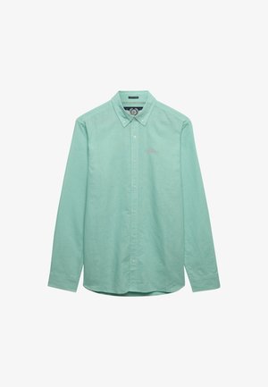 Lysegrøn langærmet skjorte med knapper og knapkrave samt lille broderet logo på venstre bryst.