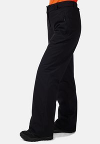 Pantaloni neri da esterno con design a gamba dritta, dotati di tasca laterale con zip e una texture di tessuto resistente.