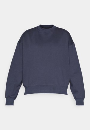 Dark blue sweatshirt with a crew neckline, dropped shoulders, and ribbed cuffs. Made from a soft, textured fabric with a relaxed fit.