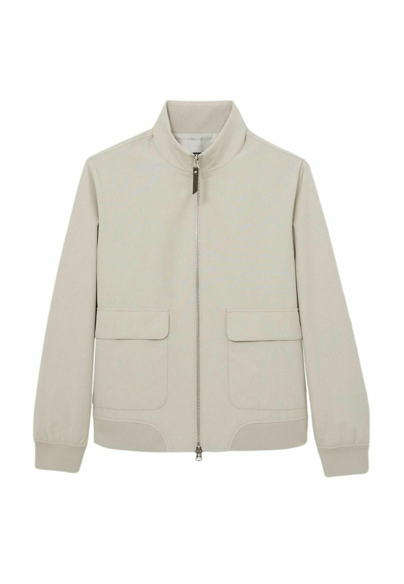 Veste zippée beige clair avec un col montant, deux poches avant, des poignets côtelés et un tissu lisse légèrement texturé.