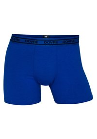 Blå bomuldsboxershorts med en tætsiddende form og en sort talje, der har brandnavnet "DOVRE" i gentaget tekst. Blød tekstur.