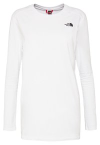 Biała koszula z długim rękawem wykonana z miękkiego materiału. Posiada okrągły dekolt oraz czarne logo na lewej piersi. Gładka tekstura, standardowy krój.