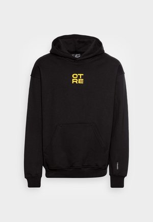 Schwarzer Hoodie aus Baumwollmischung mit einer Fronttasche. Besitzt ein gelbes Textdesign mit "CTRE" in der Mitte der Brust. Kapuze mit Kordelzug.
