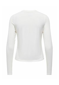 Haut blanc ajusté à manches longues vu de dos avec un col rond et un tissu lisse.