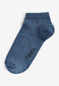 Chaussette bleue mi-mollet en tissu texturé, dotée d'un bord côtelé et d'un logo "next" noir près des orteils.